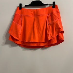 Athleta tennis skort / skirt.  Bright neon orange.  Size medium.